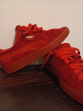 Puma Suede Low-Top Sneakers in Bright Red with Gold Logo